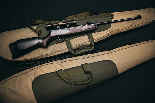 gun bag brown and black sniper rifle with beige bag scope